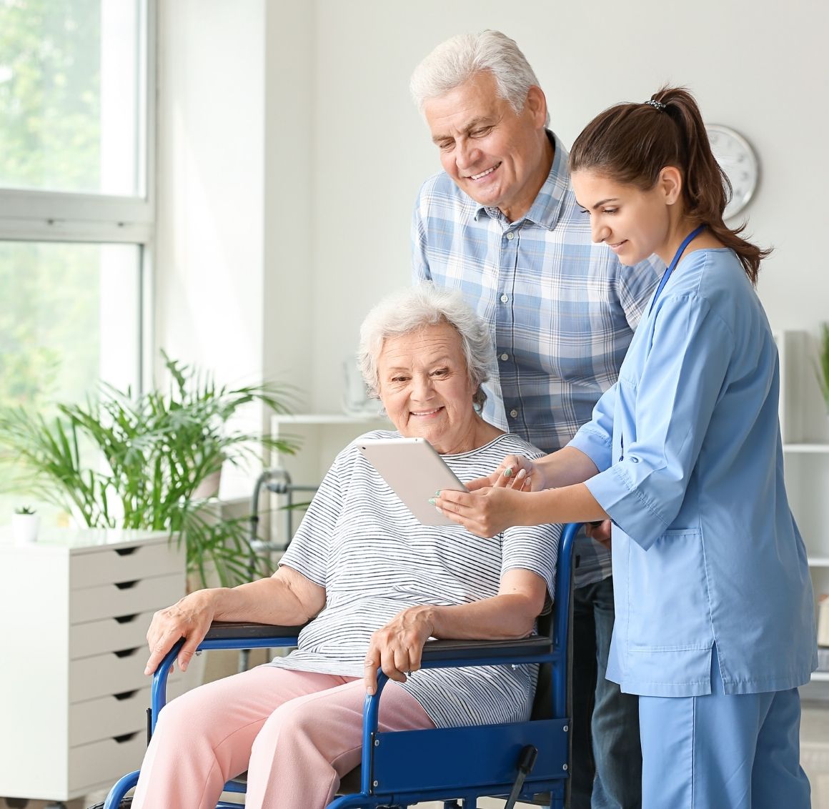 Wheelchair assistance & companionship Caregiver gently assisting an elderly woman in a wheelchair, offering support and companionship.